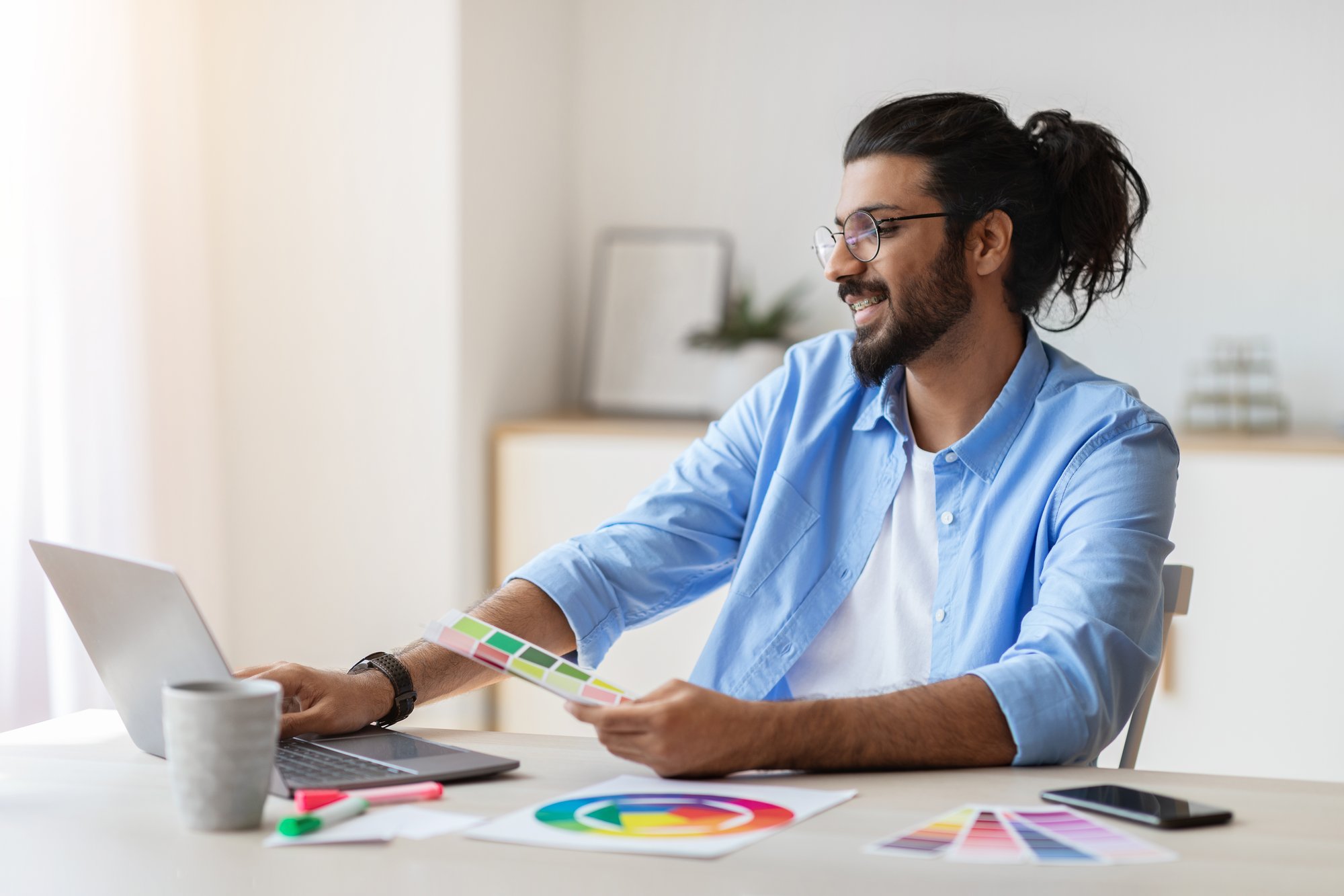 graphic-design-courses-online-arab-man-holding-co-2025-03-18-18-14-09-utc graphic-design-courses-online-arab-man-holding-co-2025-03-18-18-14-09-utc